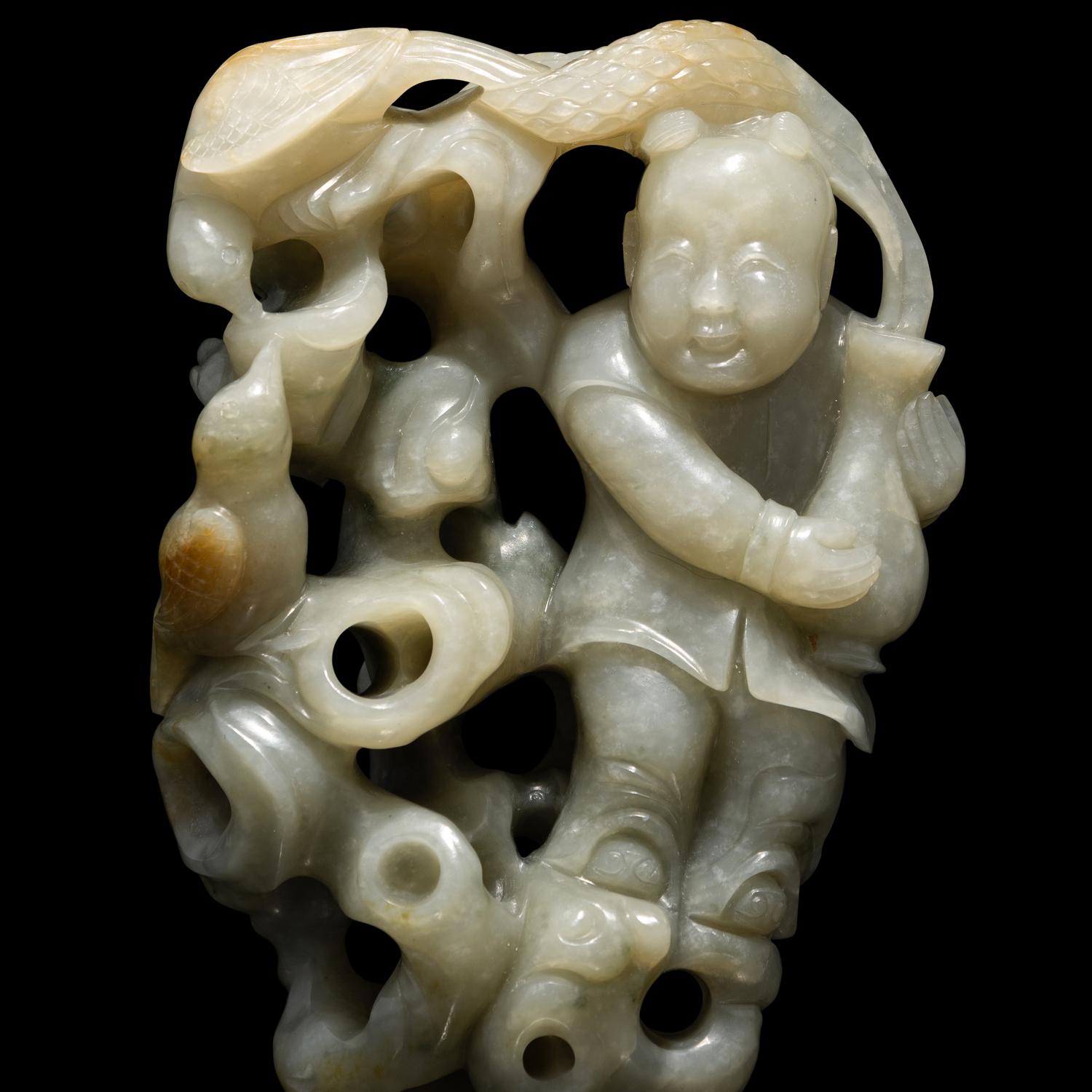 A Chinese Greyish Celadon Jade Group of a Boy and Birds, Qing Dynasty 清 青玉鏤雕童子持蓮