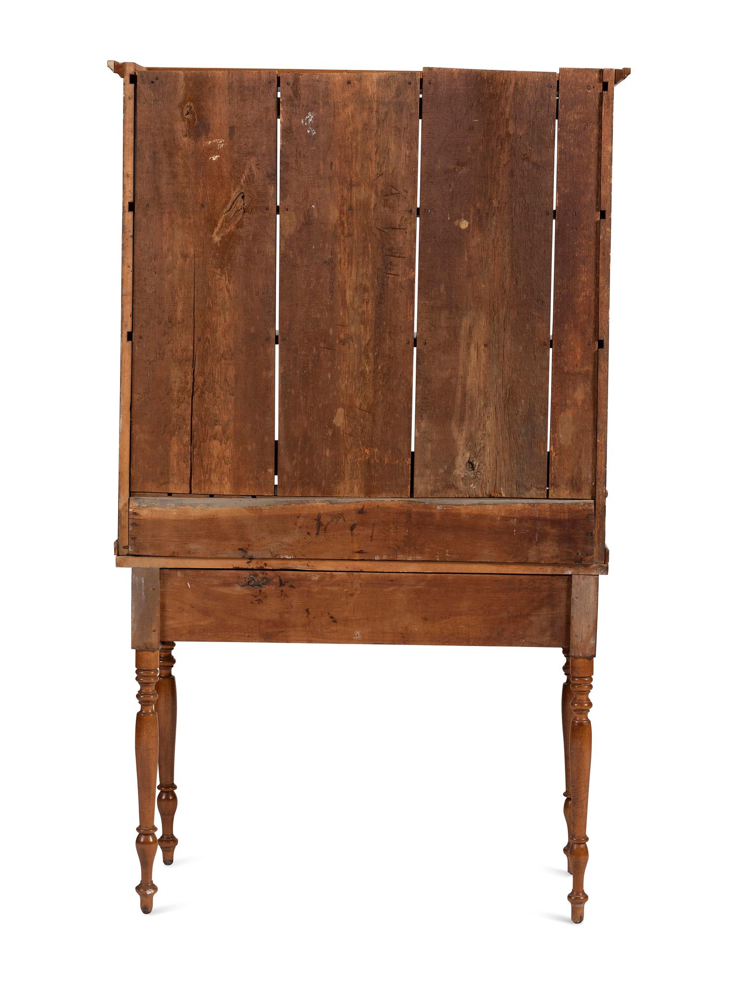 A Late Federal Cherrywood Step-Back Secretary Bookcase