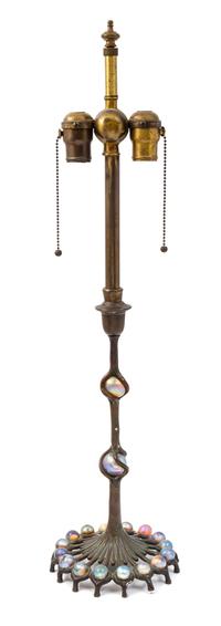 A Tiffany Studios Favrile Glass and Bronze Candlestick Height 28 inches.