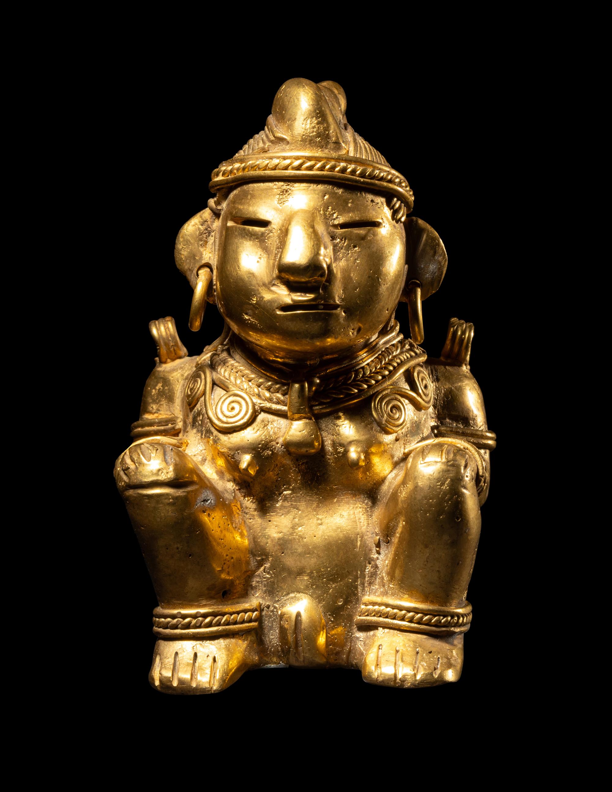 A Tairona Tumbaga Seated Female Figure