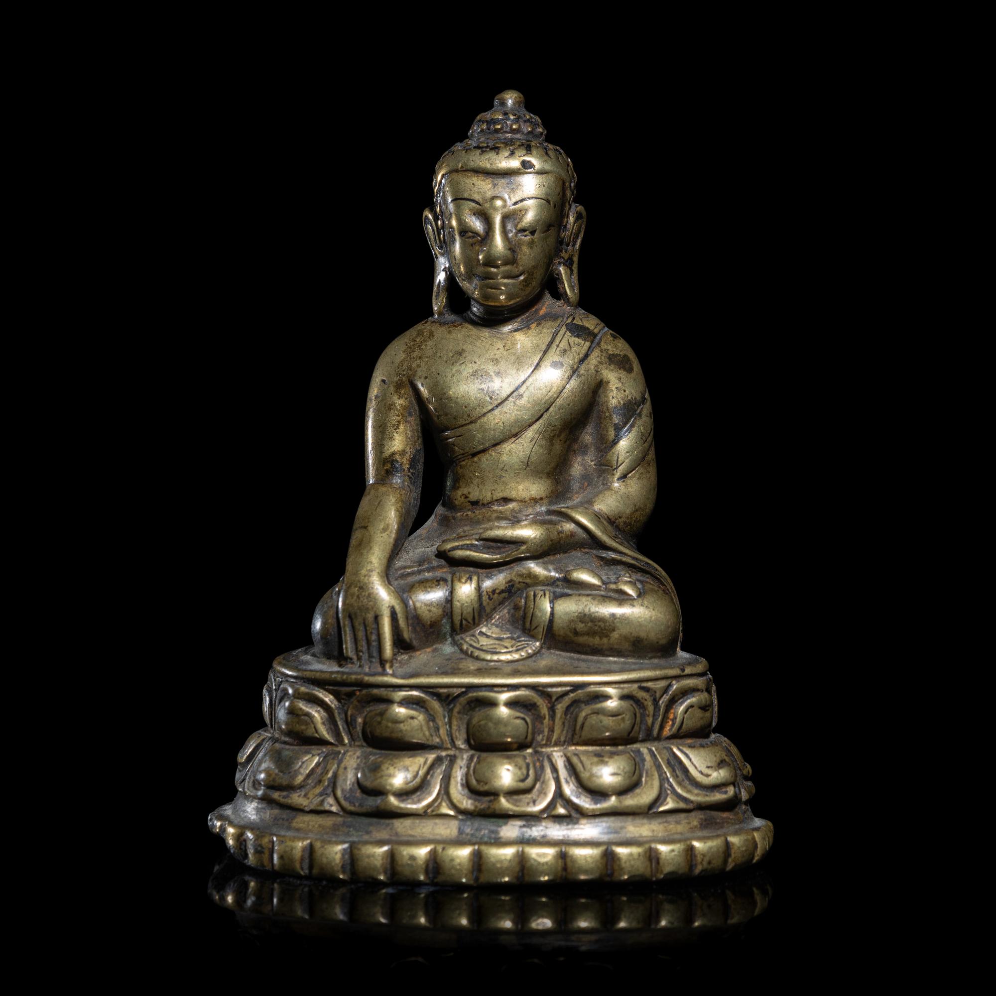A Tibetan Copper Alloy Figure of Buddha Shakyamuni, 14th/15th Century 十四/十五世紀 西藏銅坐佛
