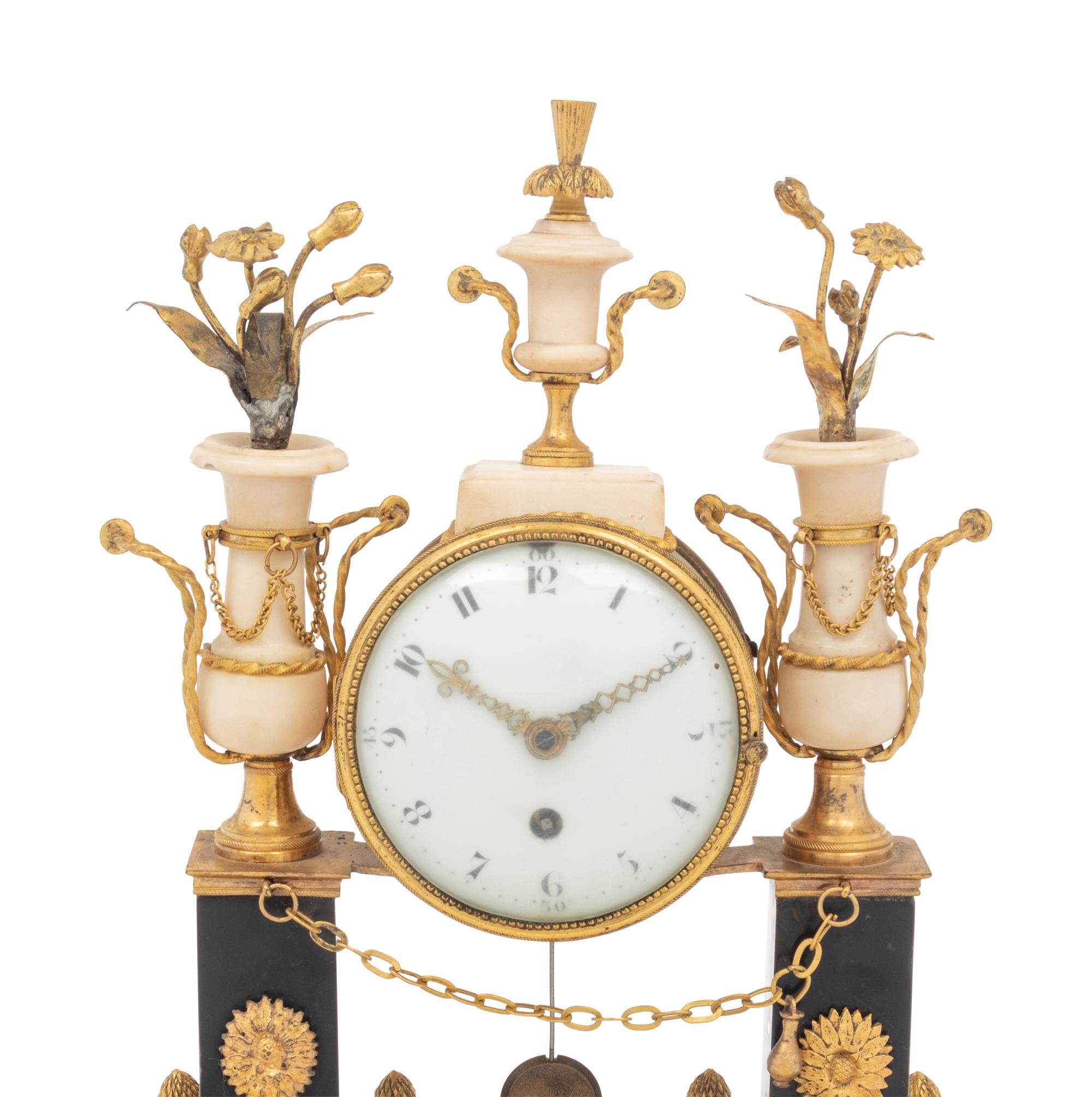 A Directoire Gilt Bronze and Marble Mantel Clock