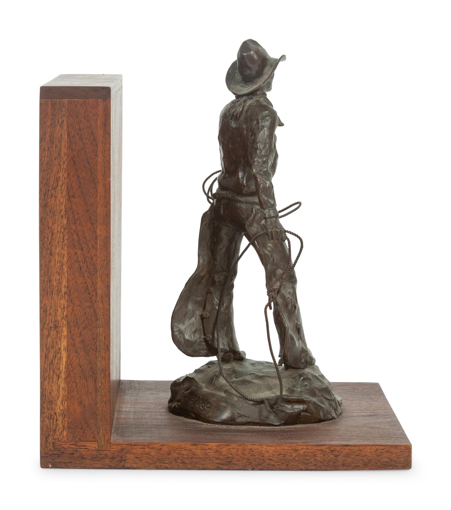 The Bronc Rider , edition 23/100, mounted as bookend; together with book, From Broncs to Bronzes: The Life and Work of Grant Speed by Don Hedgpeth