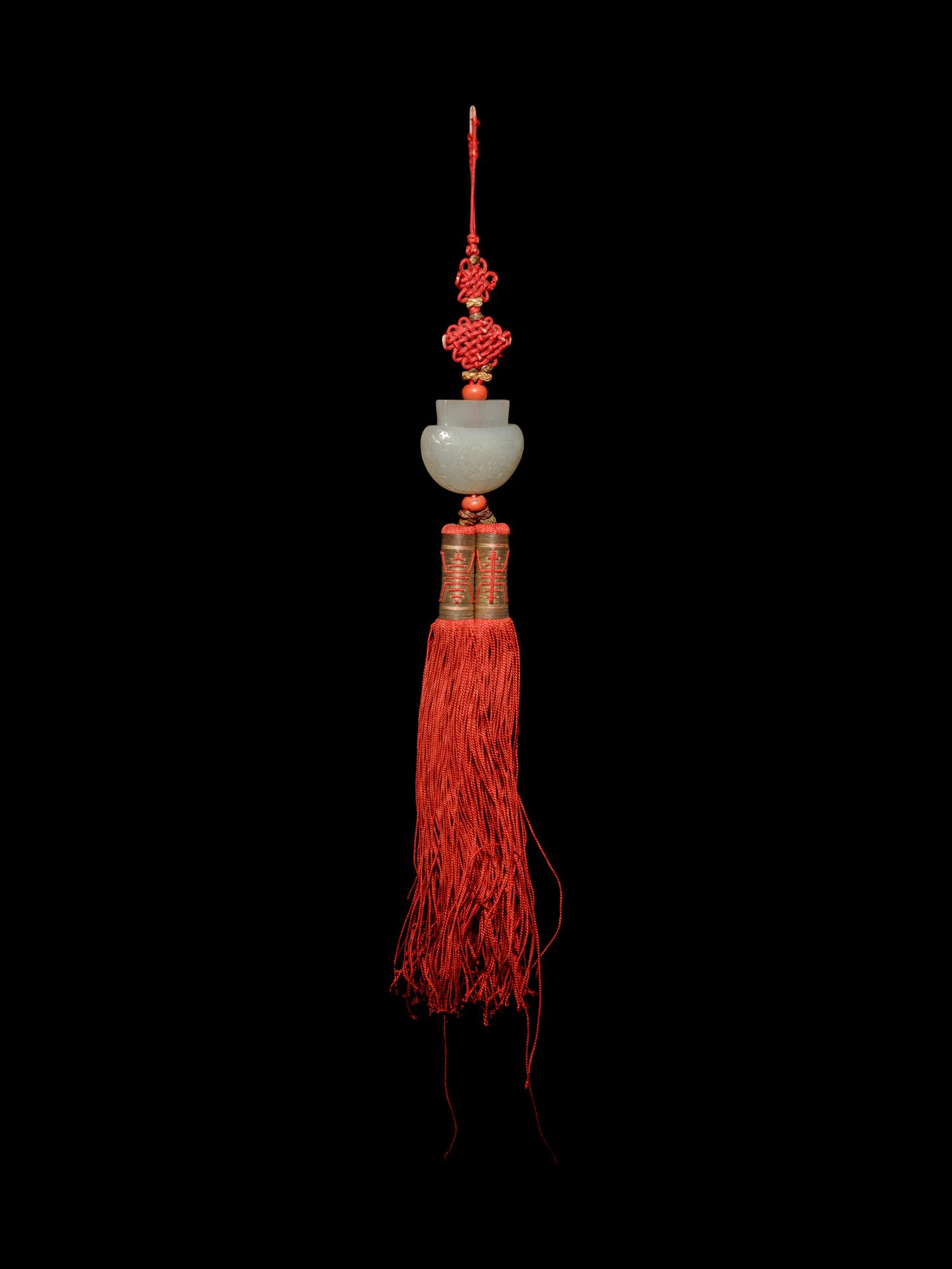 A White Jade Purse-Form Pendant