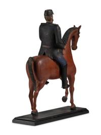 A Carved and Painted Wood Figure of a German Soldier on Horseback