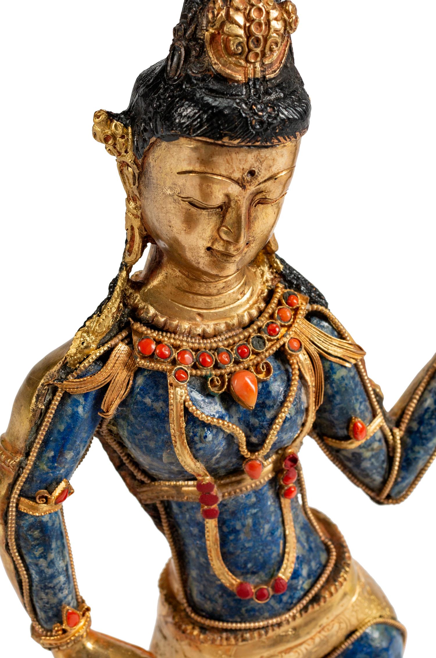 A Tibetan Jeweled Bronze and Sodalite Figure of a Deity