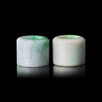 An Associated Pair of Chinese Apple Green and Celadon Jadeite Archer’s Rings, Late Qing/Republic Period 晚清-民國 翡翠扳指兩枚