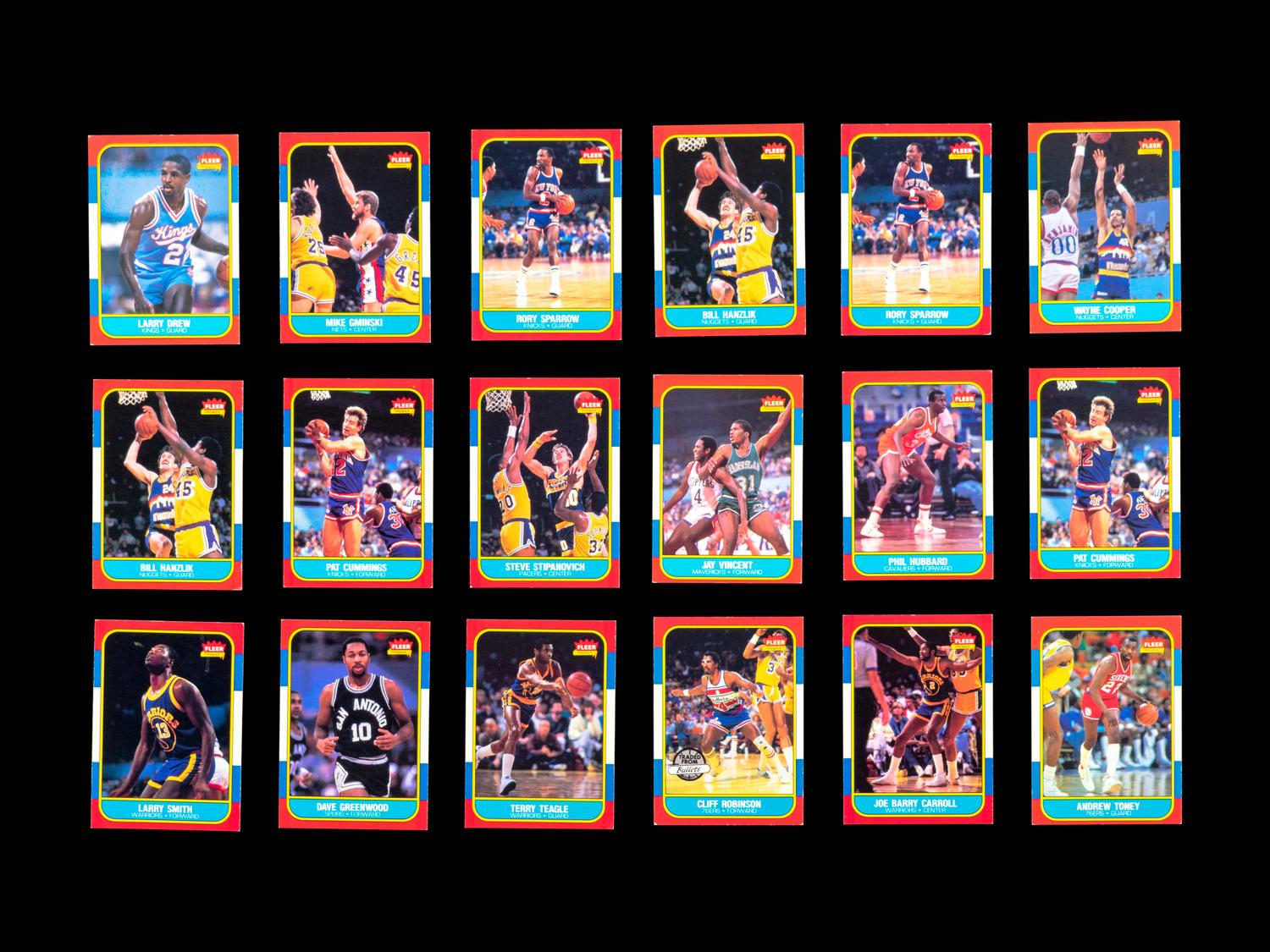 A Group of 71 1986 Fleer Basketball Cards and Stickers (Including Julius Erving, Patrick Ewing, Magic Johnson and Hakeem Olajuwon)