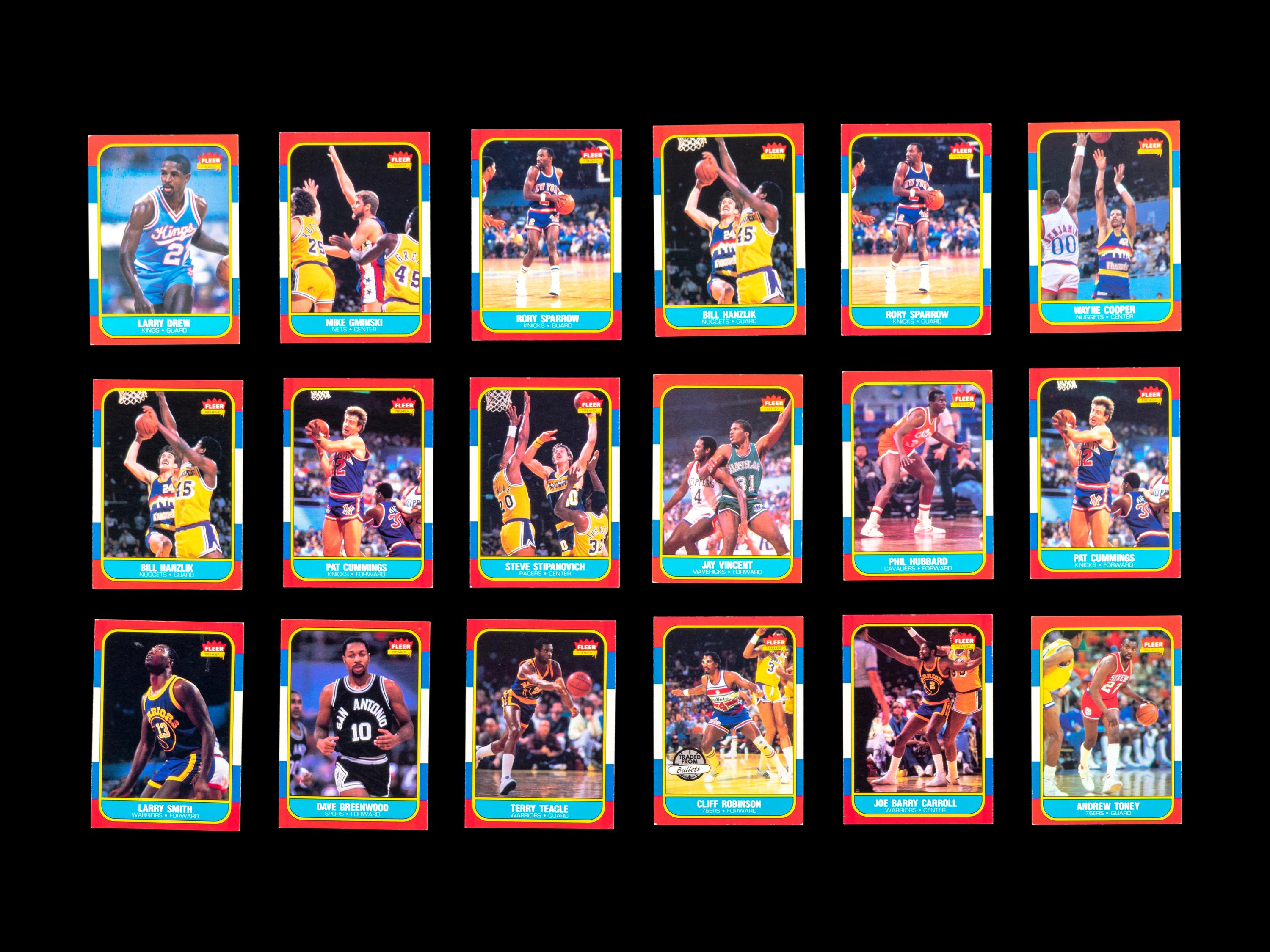 A Group of 71 1986 Fleer Basketball Cards and Stickers (Including Julius Erving, Patrick Ewing, Magic Johnson and Hakeem Olajuwon)