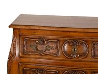 A Louis XV Provincial Style Carved Walnut Commode