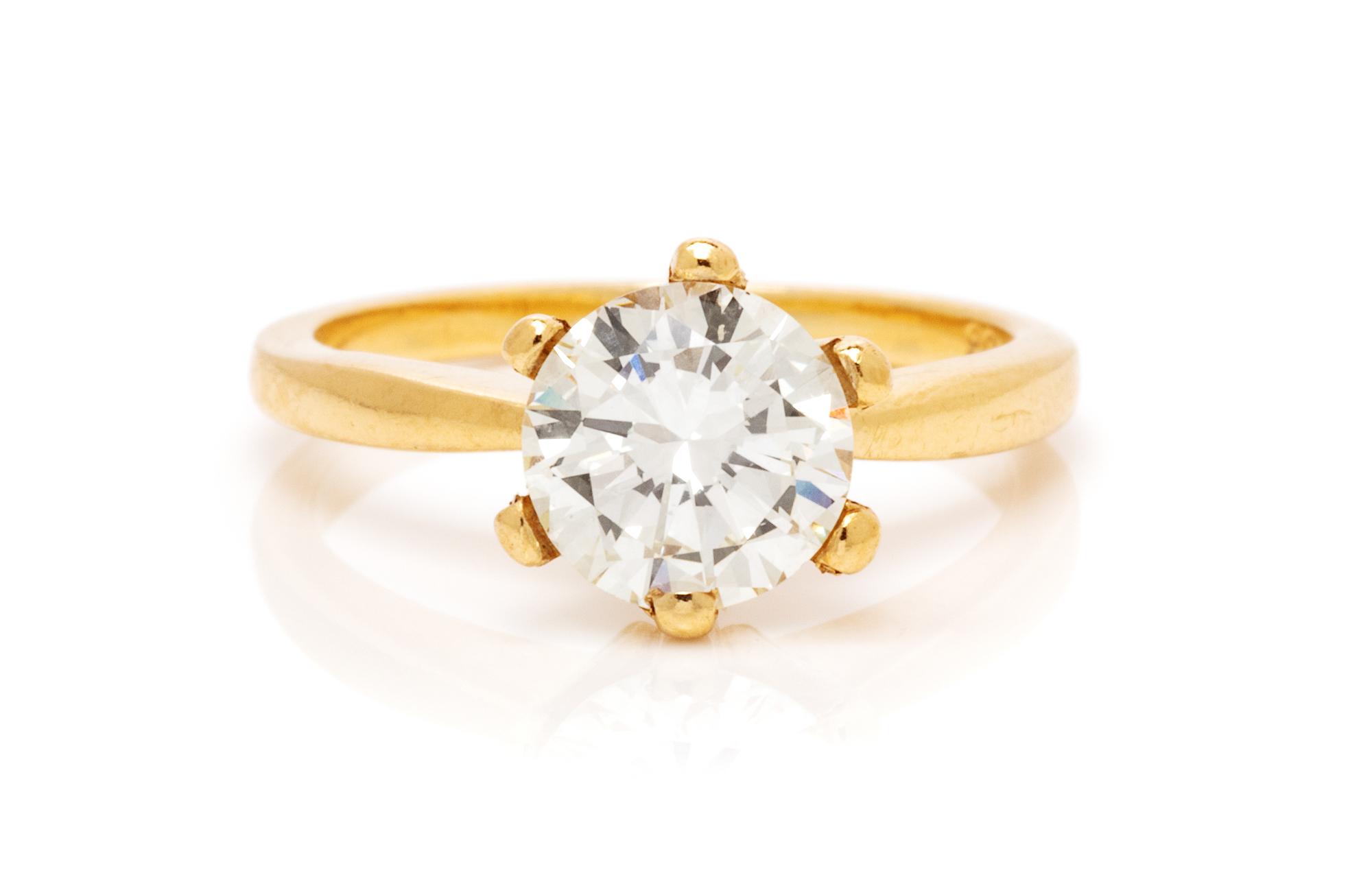 A 14 Karat Yellow Gold and Diamond Solitaire Ring, 2.20 dwts.