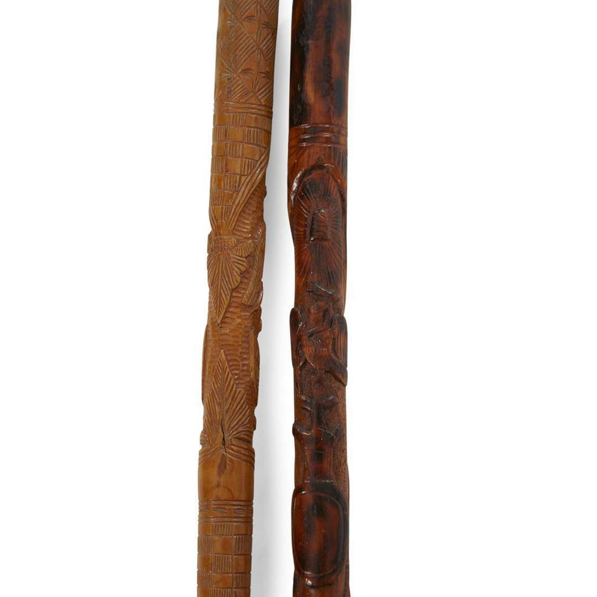 Group of seven carved wood canes with figural and patriotic motifs American and Mexican, late 19th/20th century