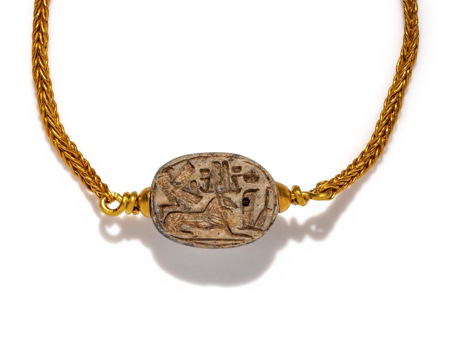 An Egyptian Steatite Scarab — Set in a gold bracelet