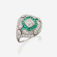 A diamond, emerald, and platinum ring