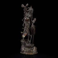 A patinated bronze figure of a Daoist immortal with crane 道教仙人与鹤铜塑 17th century ????
