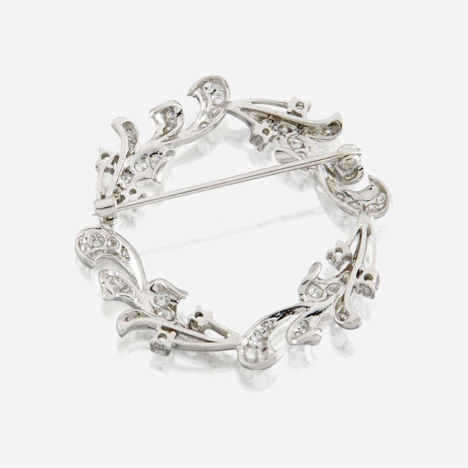 A diamond and platinum brooch