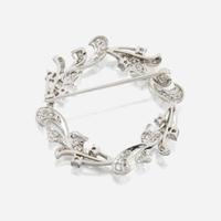 A diamond and platinum brooch