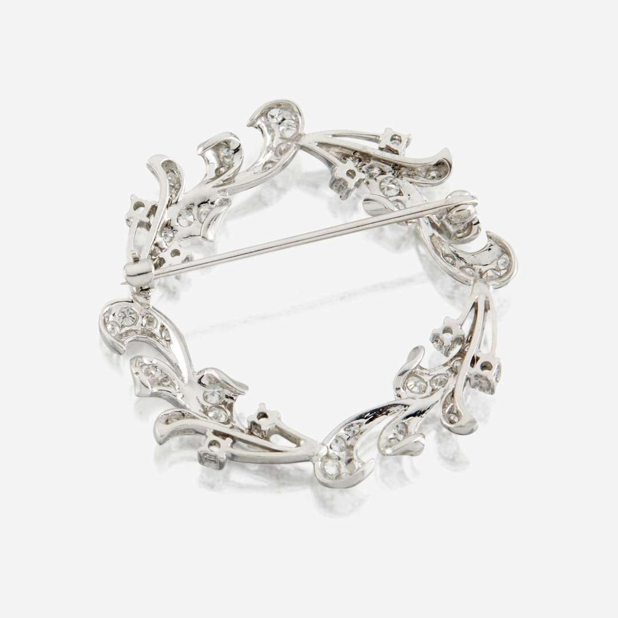 A diamond and platinum brooch