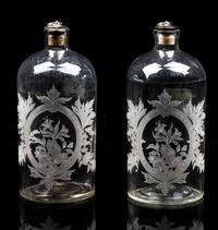 A Pair of Glass Bottles Height 8 1/4 inches.