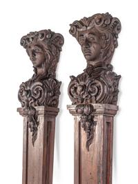 A Pair of Continental Carved Oak Figural Pilasters