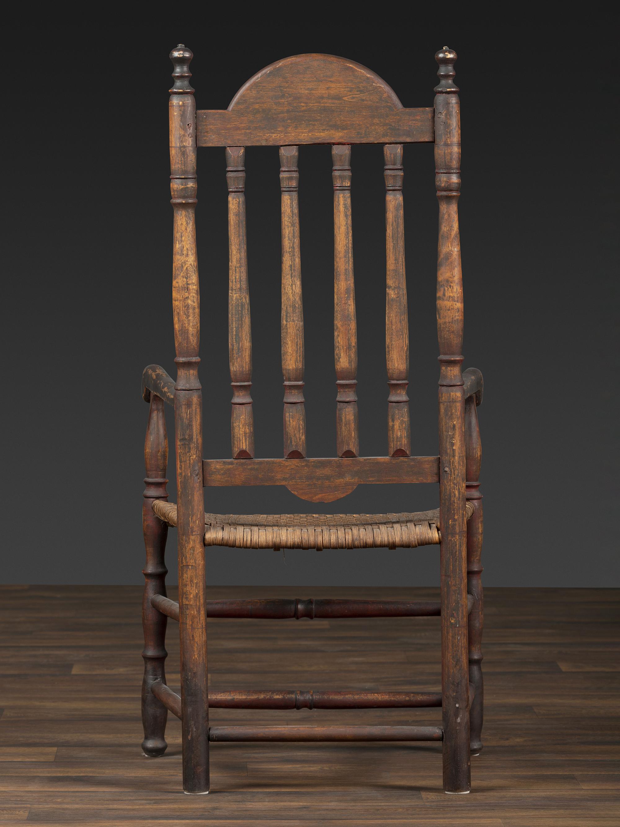 A William and Mary Style Parcel Gilt and Red Painted, Fan-Carved Bannister Back Woven Splint Seat Armchair