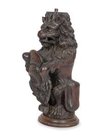 A Carved Oak Figural Newel Post