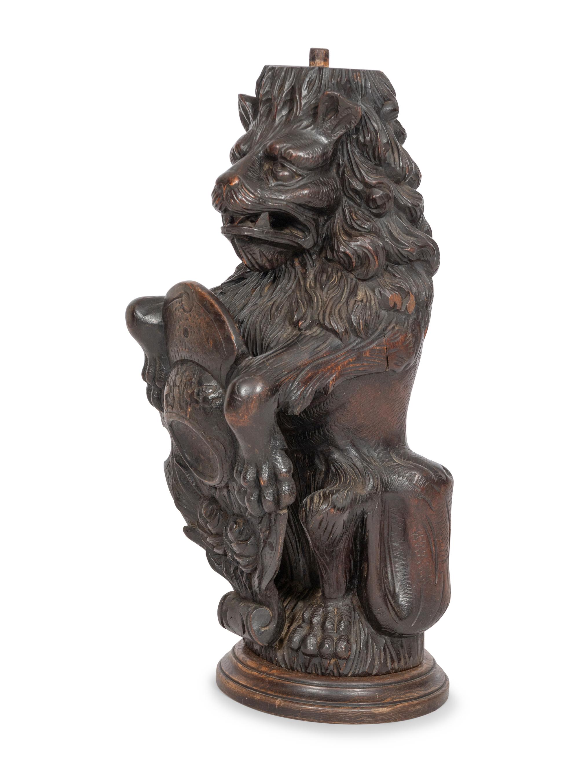 A Carved Oak Figural Newel Post