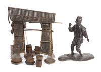 A Bronze Figure of a Man 24 1/4 x 17 3/4 inches. — MEIJI PERIOD (1868-1912)
