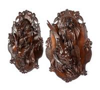 A Pair of Swiss Black Forest Carved Walnut Game Plaques