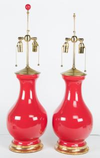 A Pair of Red Glazed Porcelain Urns Height 31 1/2 inches. — 20TH CENTURY