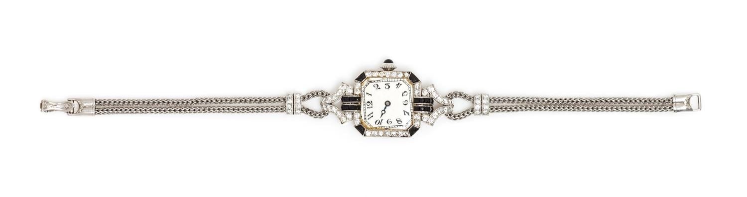 An Art Deco Platinum, Diamond and Onyx Wristwatch, C.H. Meylan for Henry Blank & Co., 18.00 dwts.