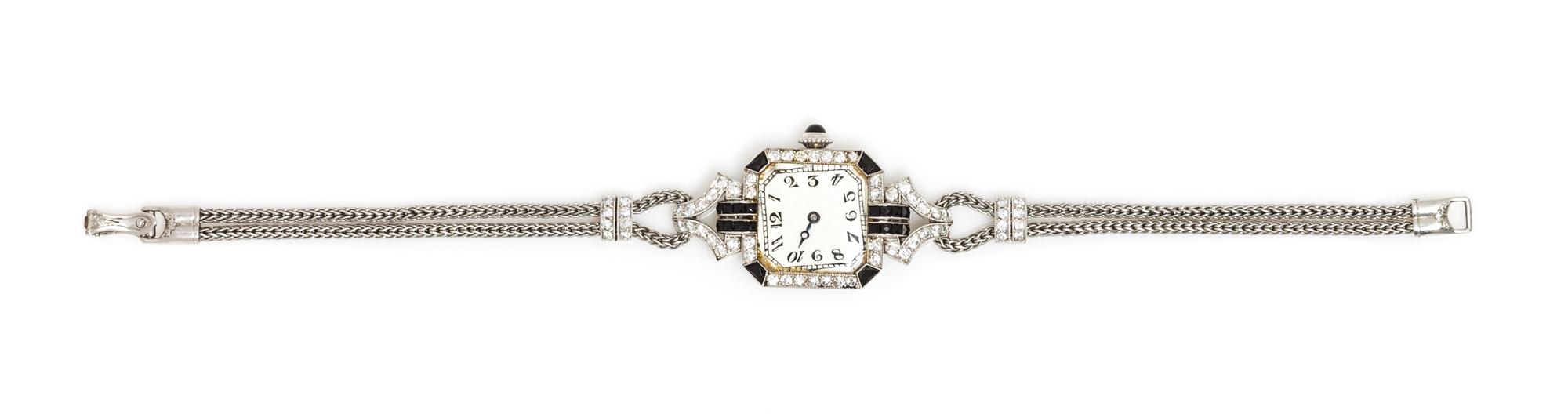 An Art Deco Platinum, Diamond and Onyx Wristwatch, C.H. Meylan for Henry Blank & Co., 18.00 dwts.