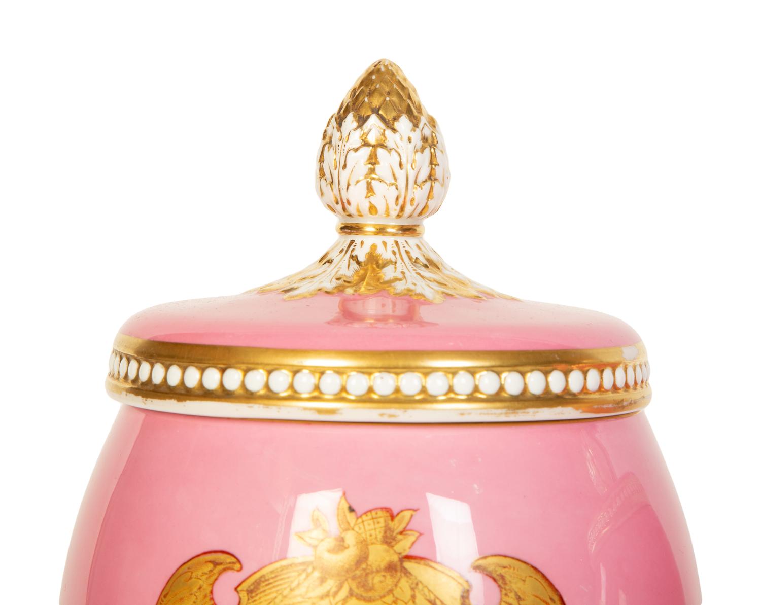A Pair of English or Continental Porcelain Pink-Glazed Urns