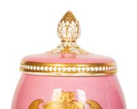 A Pair of English or Continental Porcelain Pink-Glazed Urns