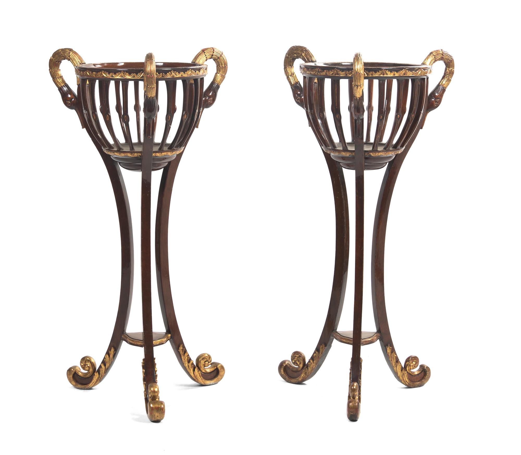 A Pair of Empire Mahogany and Parcel Gilt Jardinieres on Stands, Height 48 inches.