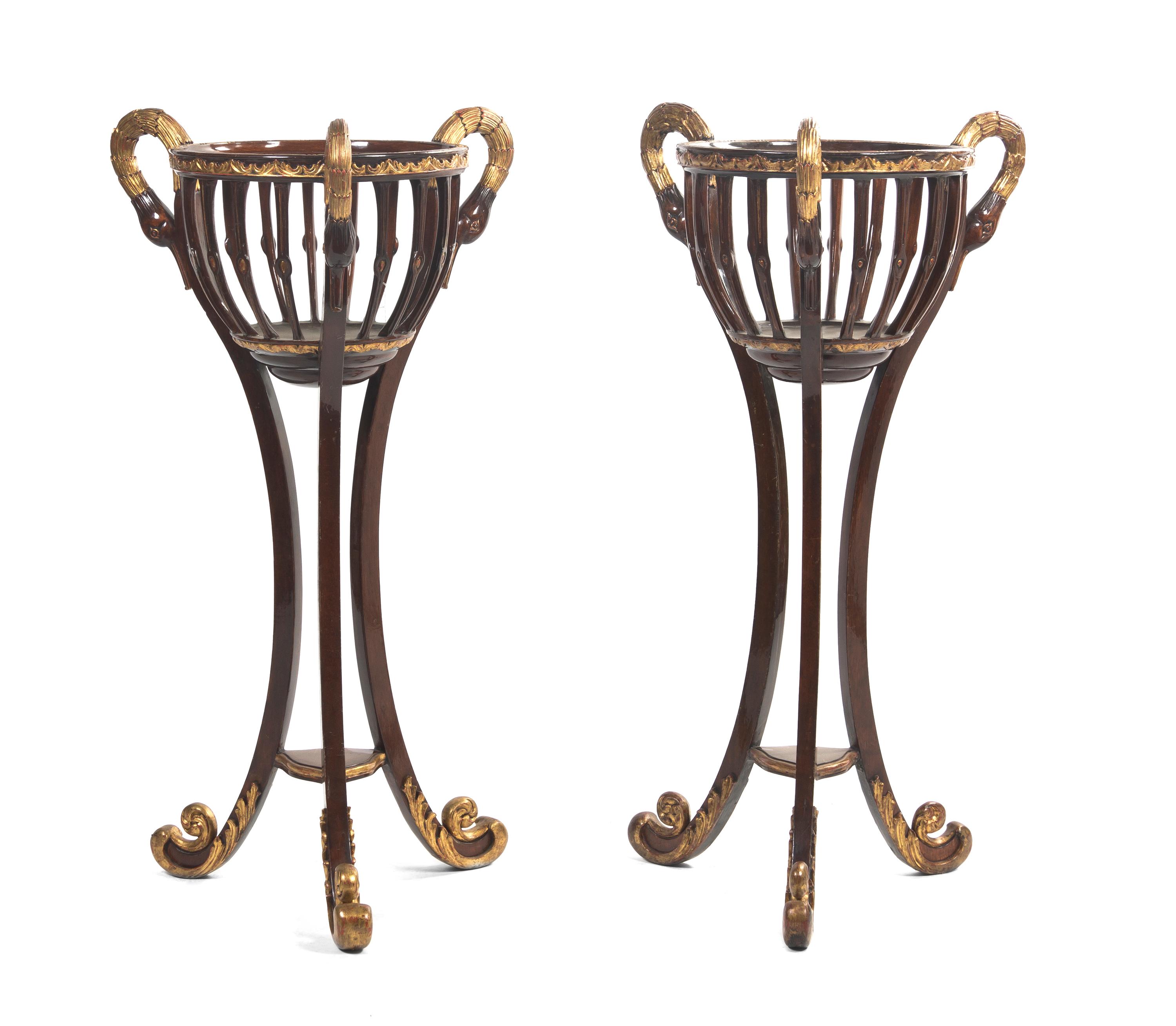 A Pair of Empire Mahogany and Parcel Gilt Jardinieres on Stands, Height 48 inches.