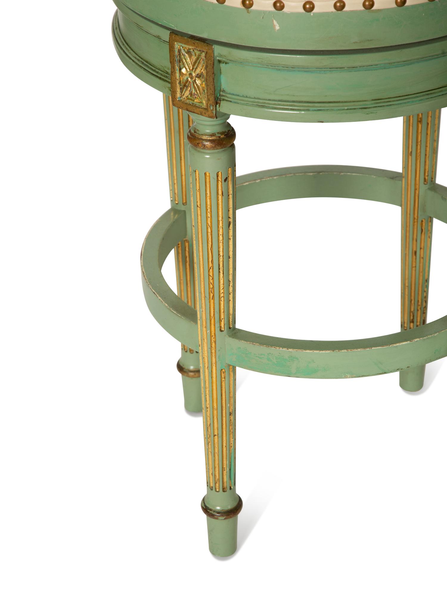Four Louis XVI Style Painted, Parcel Gilt and Cane Back Barstools