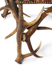 A Tapestry Upholstered Elk Antler Club Chair