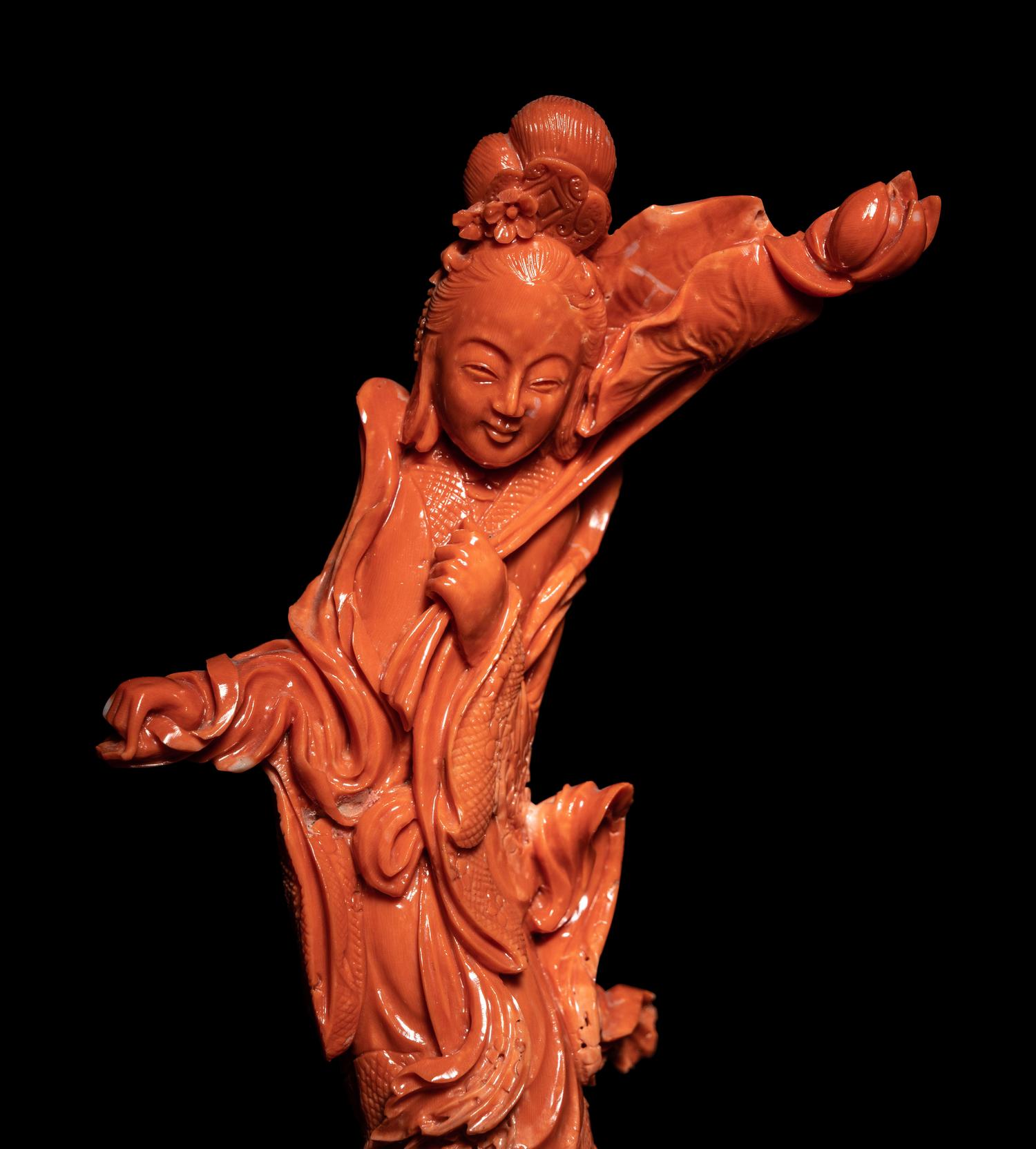 A Chinese Carved Red Coral Figure of a Female Immortal