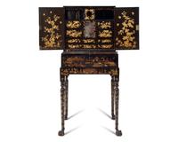 A Chinese Export Black Lacquer and Parcel-Gilt Cabinet and Work Table
