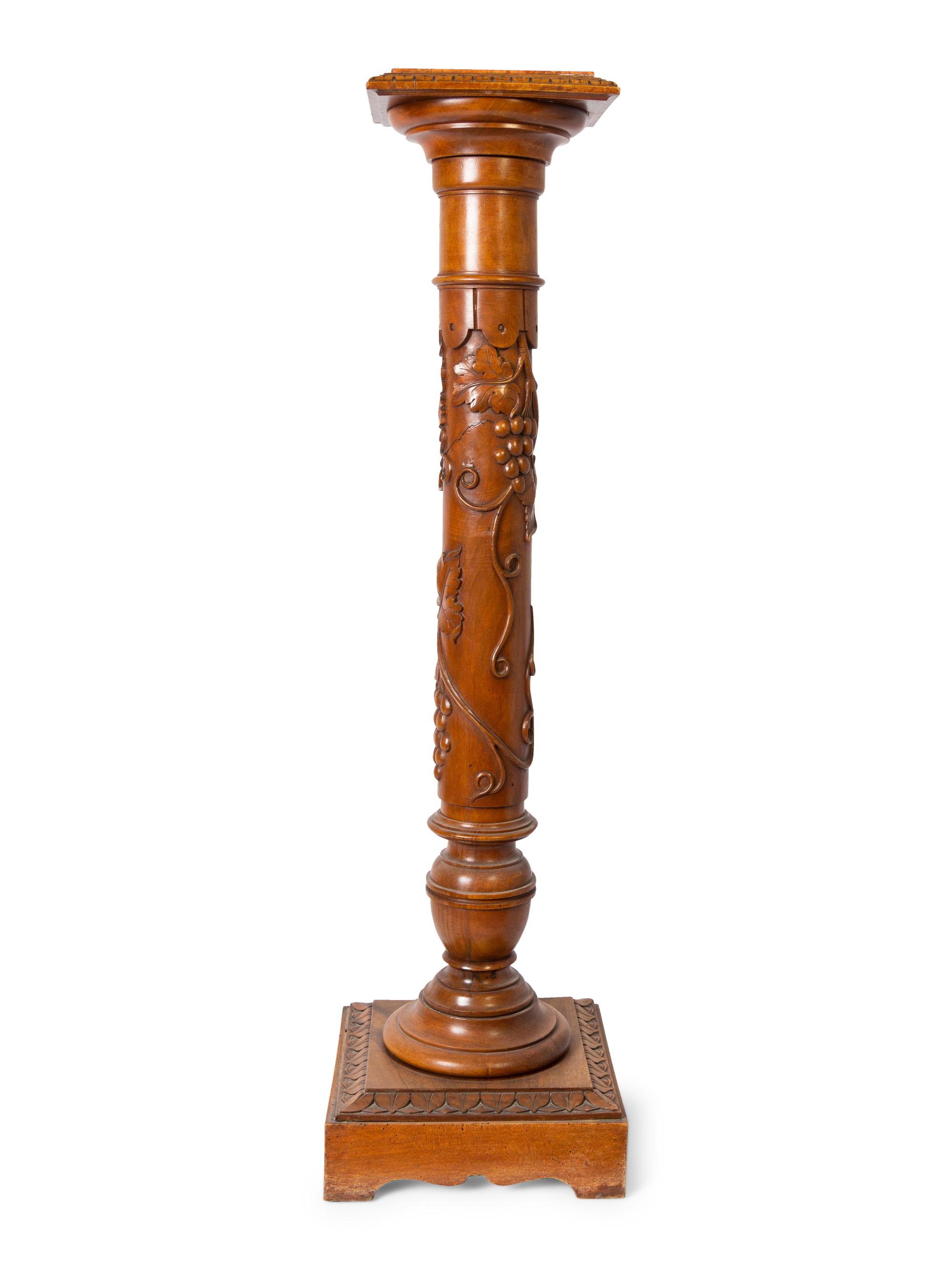 An Italian Carved Walnut Marble-Top Pedestal