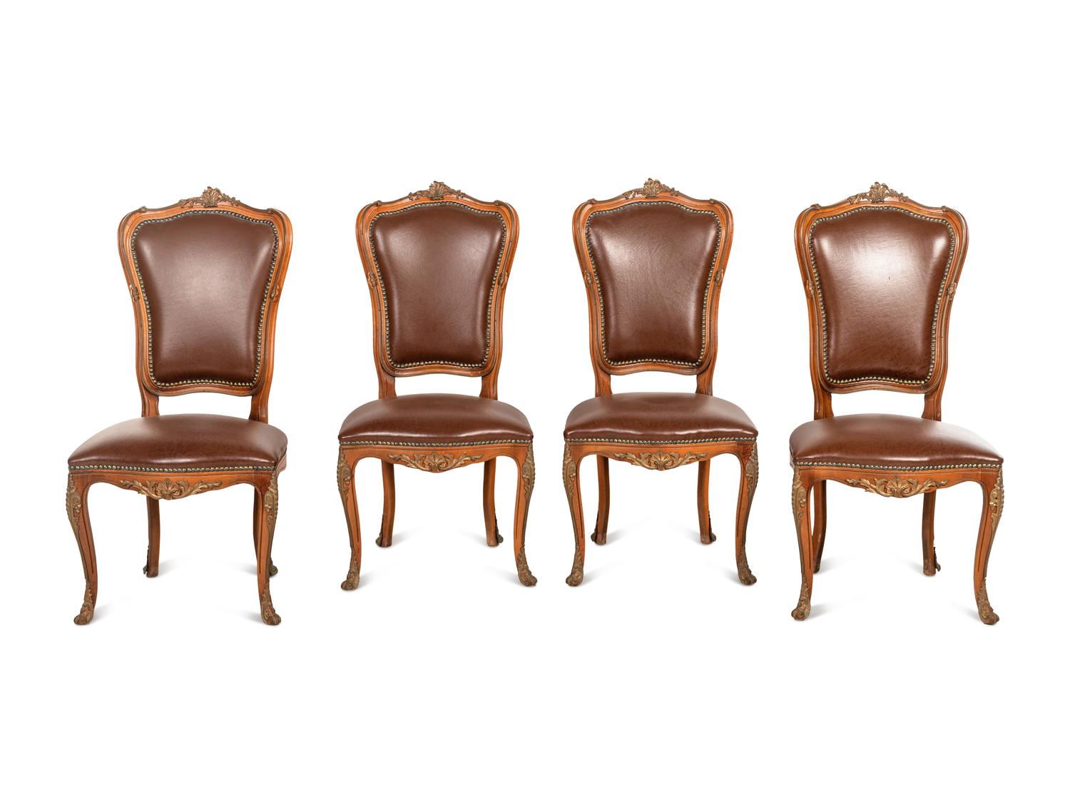 A Set of Four Louis XV Style Gilt Bronze Mounted Dining Chairs