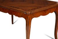 A Louis XV Style Gilt Bronze Mounted Tulipwood and Marquetry Extension Dining Table