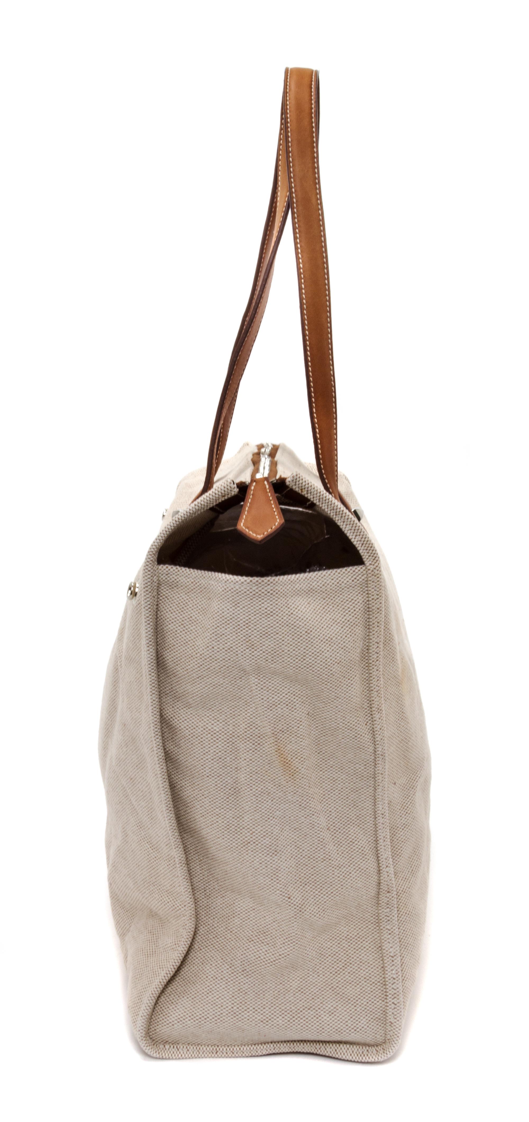 An Hermes Ecru Toile and Veau Barenia Mira Tote Bag, 14" x 14" x 5.5".