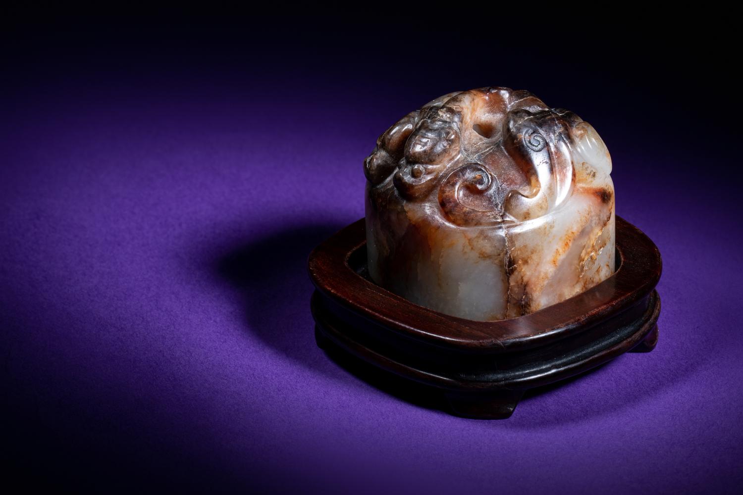 A Chinese White and Russet Jade Seal