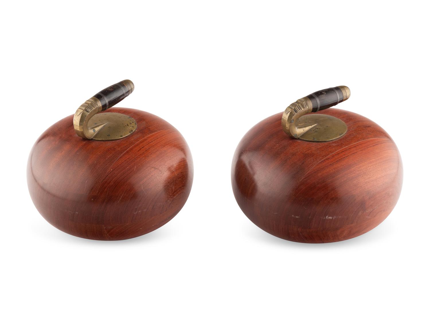 Two Metal Mounted Carved Wood Curling Stones