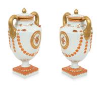 A Pair of Neoclassical Style Porcelain Urns with Bell Flower Swags