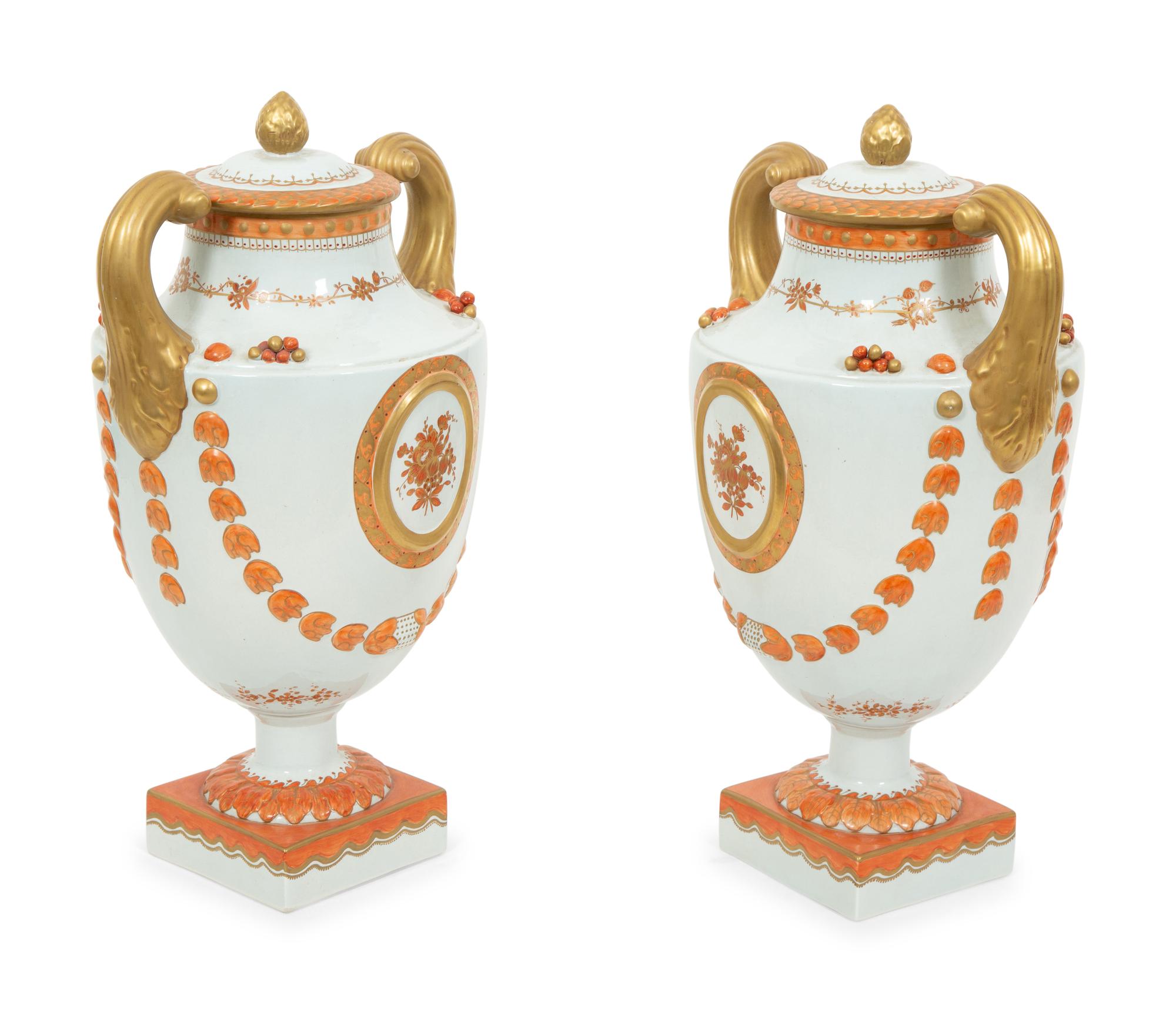 A Pair of Neoclassical Style Porcelain Urns with Bell Flower Swags