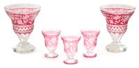 A Collection of Cranberry Cut-to-Clear Glass Height of vase 8 1/2 inches. — 20TH CENTURY