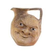 A Martin Brothers Salt Glazed Stoneware Face Jug Height 6 7/8 inches. — CIRCA 1890
